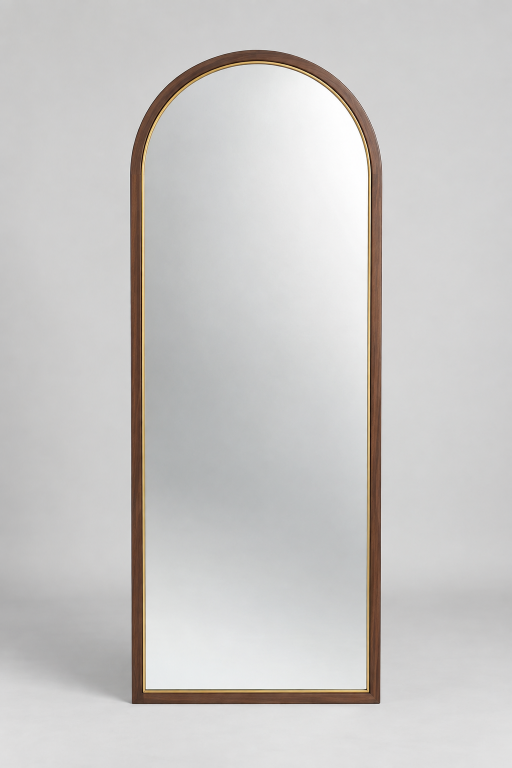 Arched wall mirror with premium frame on light grey background