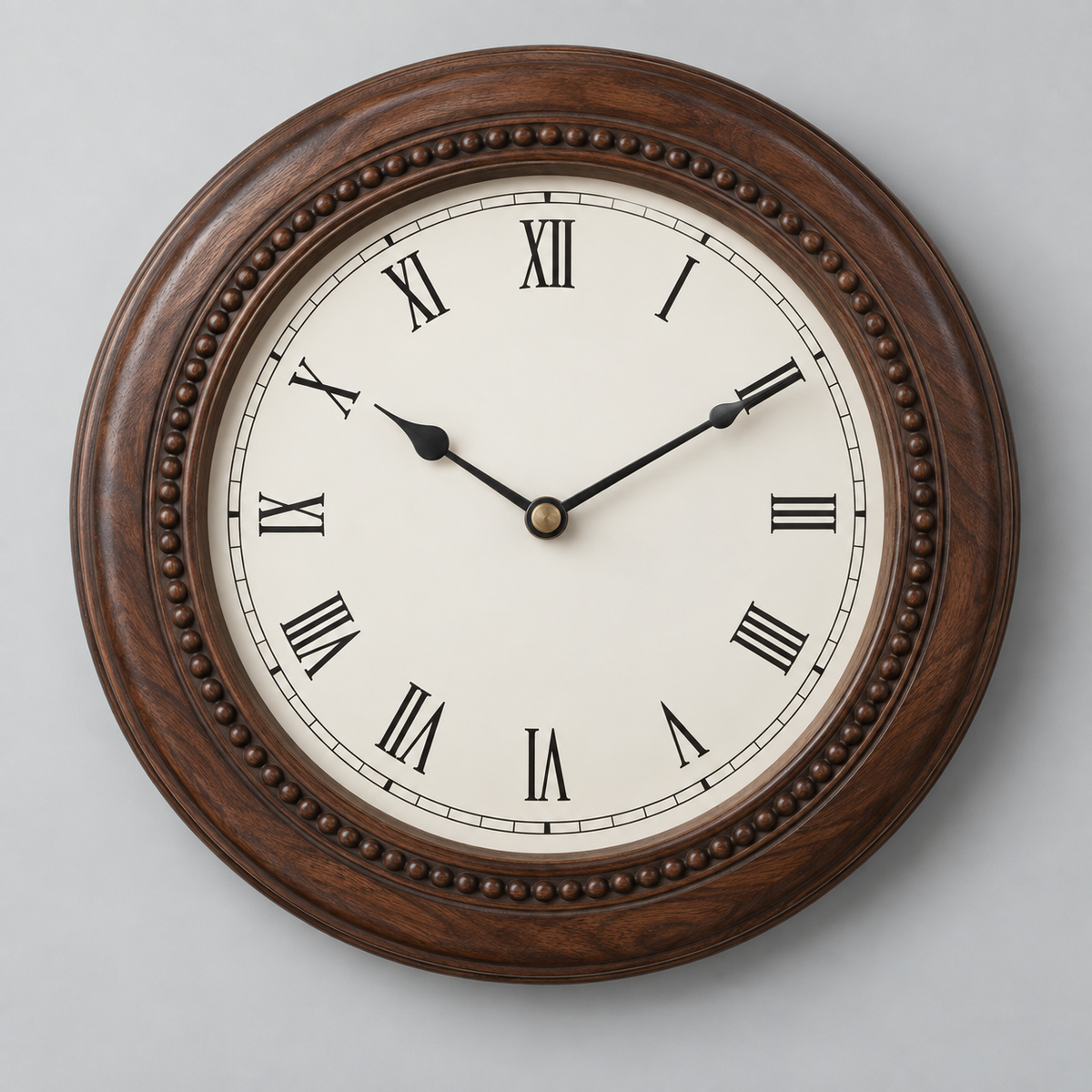 Wooden wall clock on light grey background